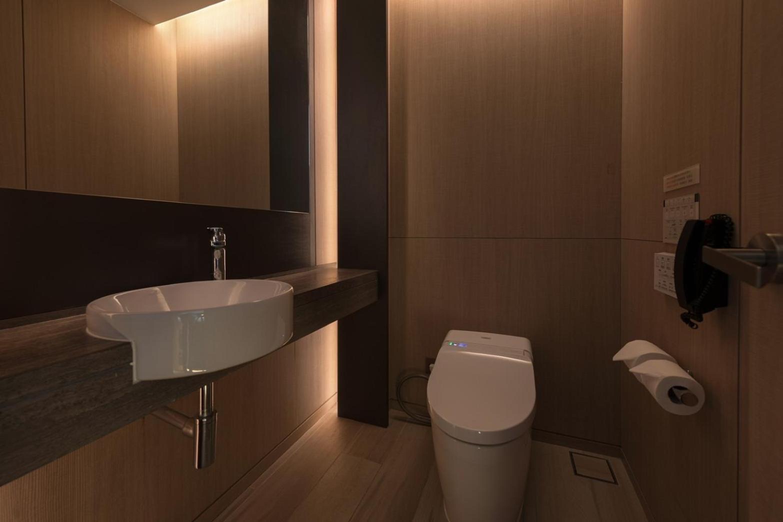 Mu Jiaoxi Hotel Kültér fotó A modern bathroom