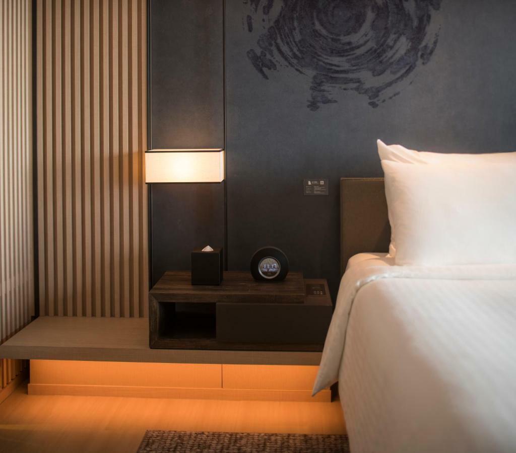 Mu Jiaoxi Hotel Kültér fotó A room at the hotel