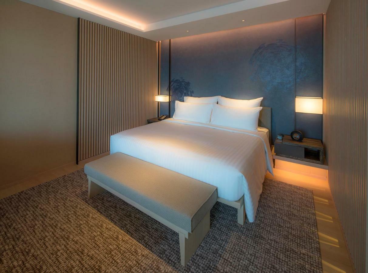 Mu Jiaoxi Hotel Kültér fotó A bedroom at the hotel