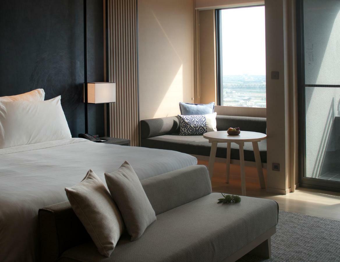 Mu Jiaoxi Hotel Kültér fotó A bedroom at the hotel